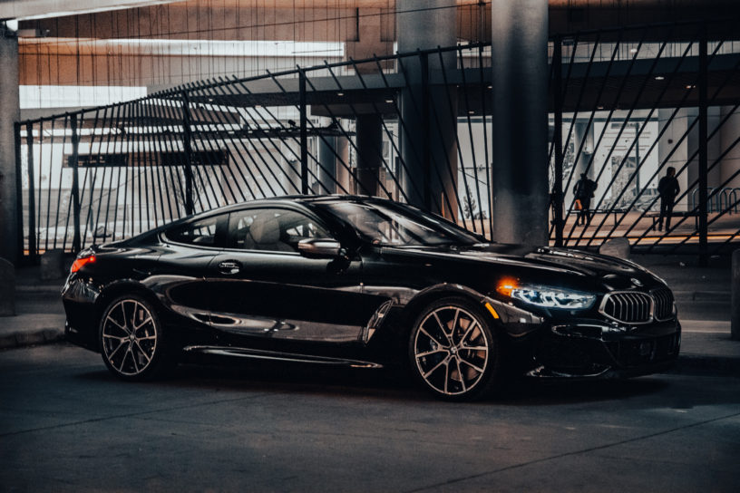 2019 BMW M850i xDrive in Carbon Black Metallic - Front Passenger 3/4 View