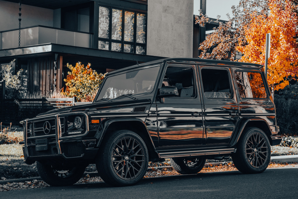 2016 Mercedes-Benz G 63 AMG 4MATIC in Midnight Blue - Front Driver’s Side 3/4 View with Trees