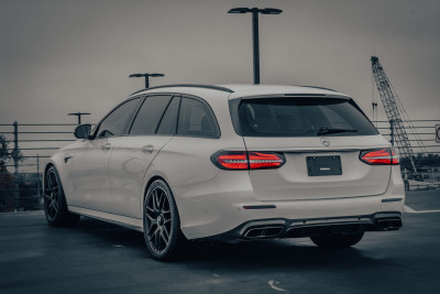 2018 Mercedes-Benz E 63 S AMG 4MATIC Wagon in Polar White - Rear Driver’s 3/4 View